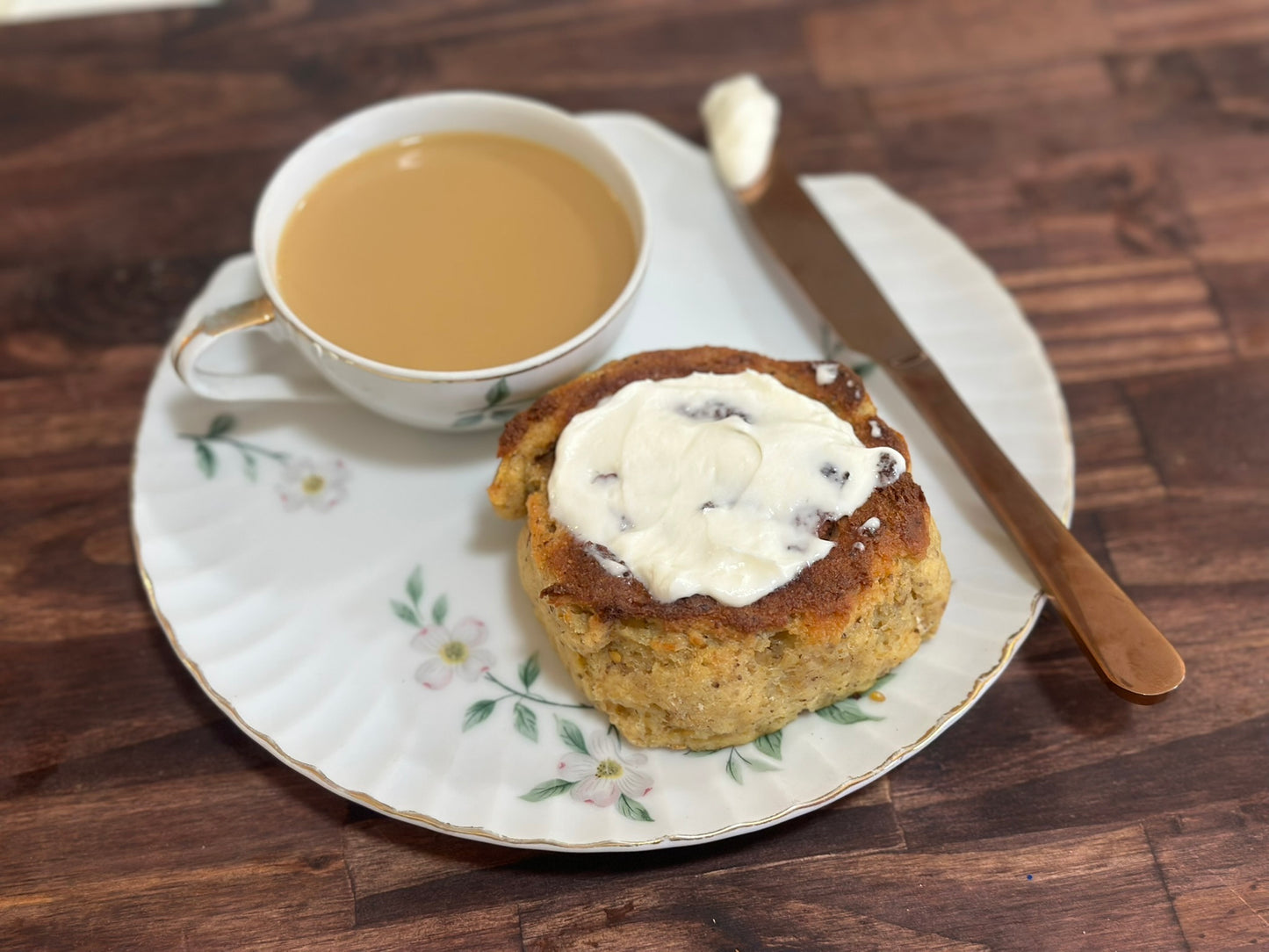 Keto Cinnamon Roll, Cup of coffee and Cream Cheese Frosting