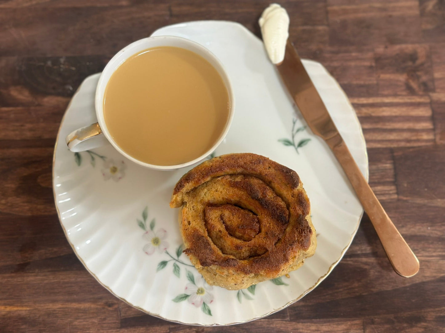 Keto Cinnamon Roll, Cup of coffee and Cream Cheese Frosting