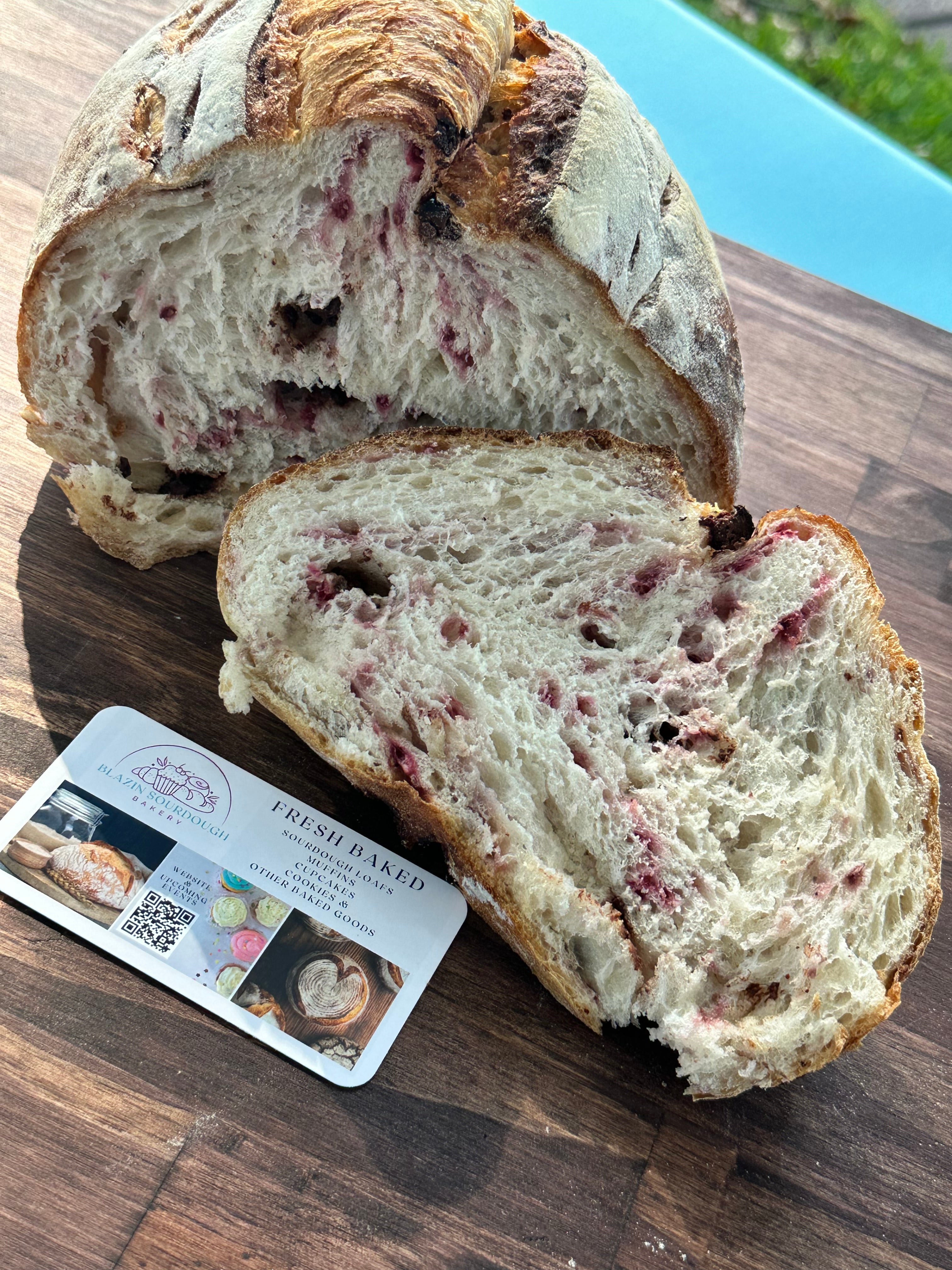 Sliced loaf of bread on a wooden board with a product card underneath